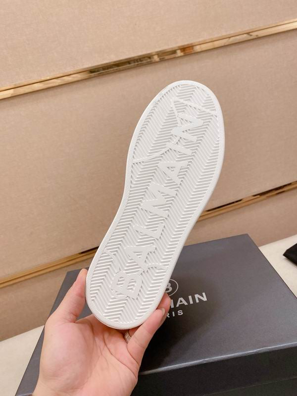 Navy Embossed High-Top Sneakers on Display