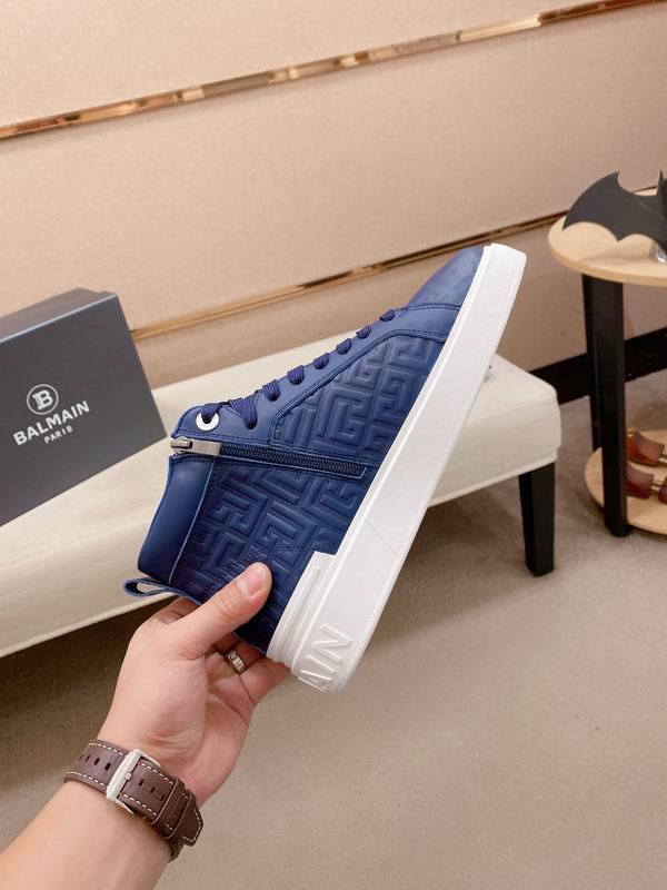 Navy Embossed High-Top Sneakers on Display